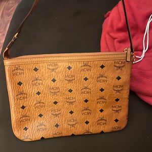 Mcm barley used leather clutch stylish for any outing